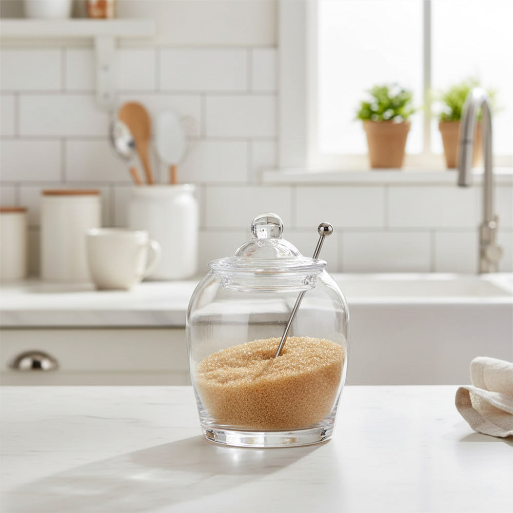 جرة زجاجية مع غطاء وملعقة